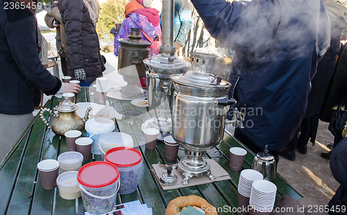 Image of people make hot tea coffee retro equipment tool 