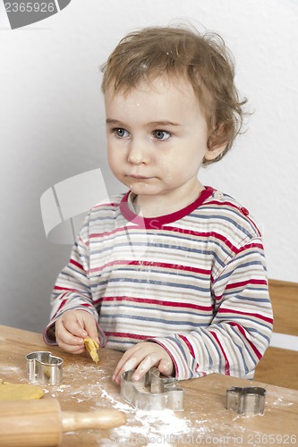 Image of young child making cookies