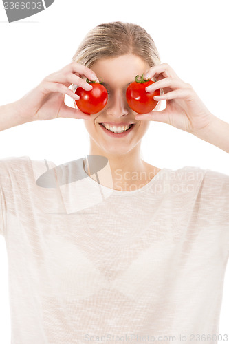 Image of Beaitiful woman with tomatos in front of the face