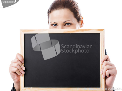 Image of Business woman holding a chalk board