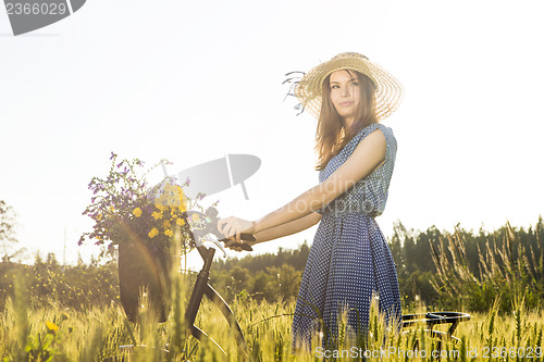 Image of Beautiful woman with her bicycle