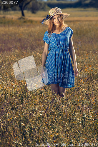 Image of Beautiful girl on a blue dress