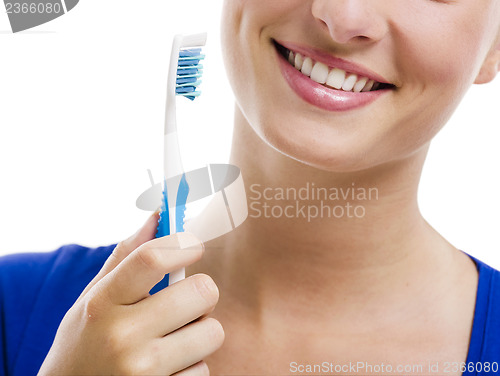 Image of Beautiful woman with a toothbrush