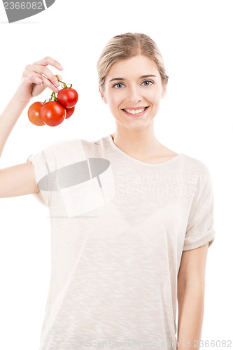 Image of Beaitiful woman holding red tomatos