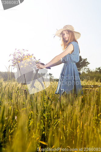 Image of Beautiful woman with her bicycle