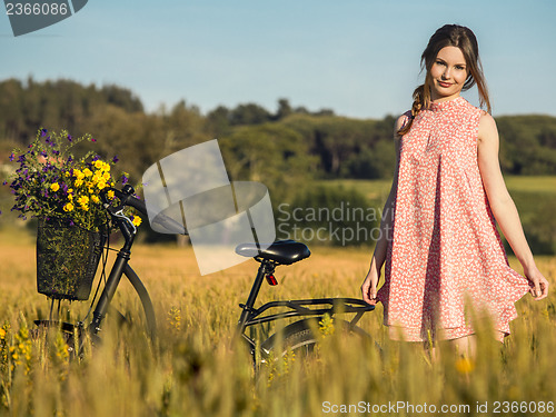 Image of Beautiful woman with her bicycle