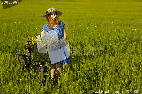 Image of Beautiful woman with her bicycle