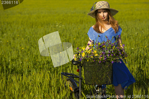 Image of Beautiful woman with her bicycle