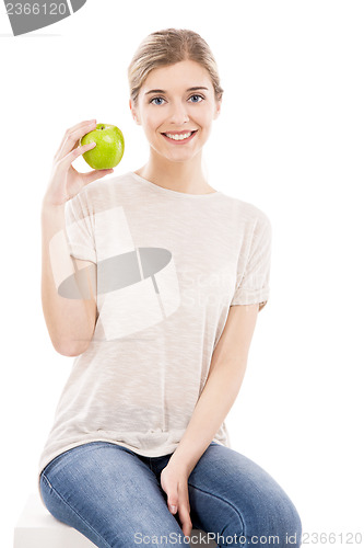 Image of Beautiful woman with a green apple