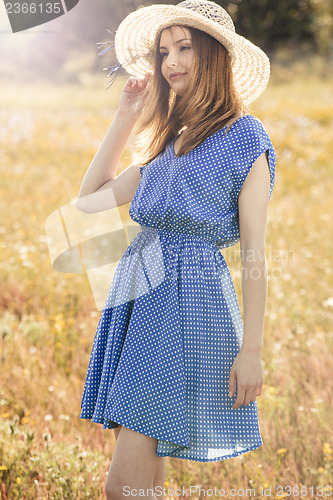 Image of Beautiful girl on a blue dress