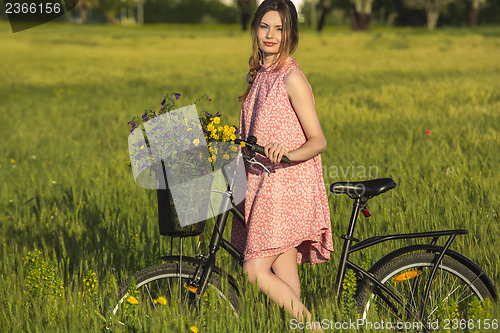 Image of Beautiful woman with her bicycle