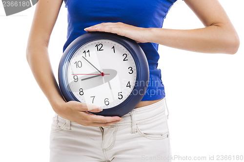 Image of Beautiful woman with a clock