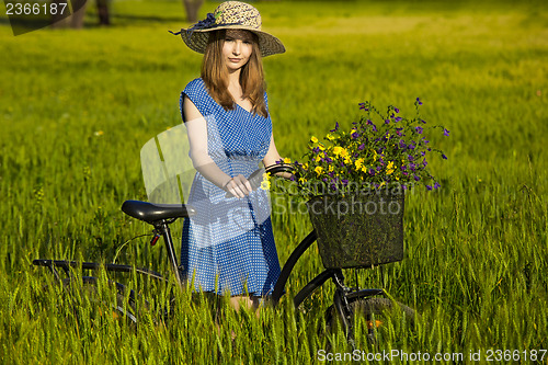 Image of Beautiful woman with her bicycle