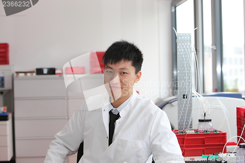 Image of Asian technician working in a laboratory