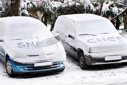 Image of Snow letters written on cars