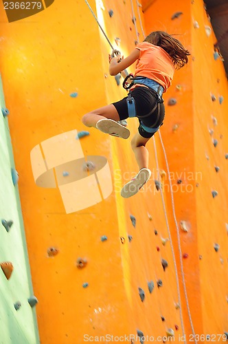 Image of child sliding down the  climbing wall