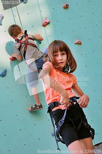 Image of children with climbing equipment against the training wall
