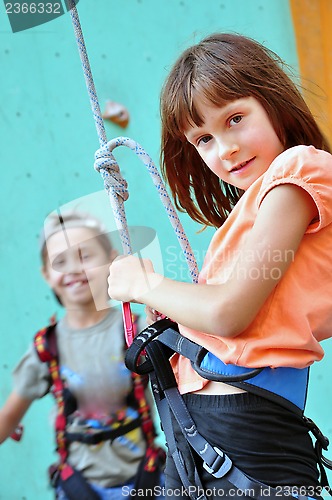 Image of children with climbing equipment against the training wall