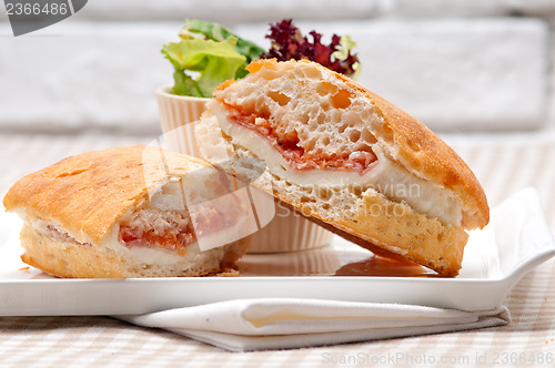 Image of ciabatta panini sandwich with parma ham and tomato