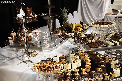 Image of Colorful desserts and pastry served on a wedding party
