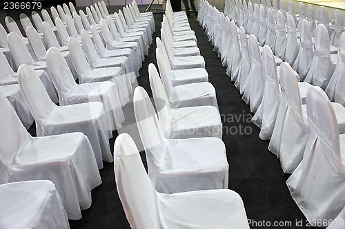 Image of Rows of white chairs