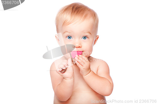 Image of Cute baby with food spon in mouth