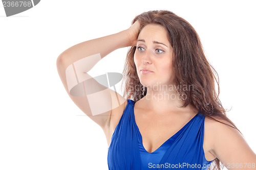 Image of Portrait of a beautiful young woman in blue dress, holding on to