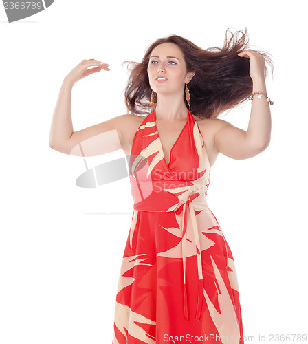 Image of Portrait of a smiling young woman in red dress
