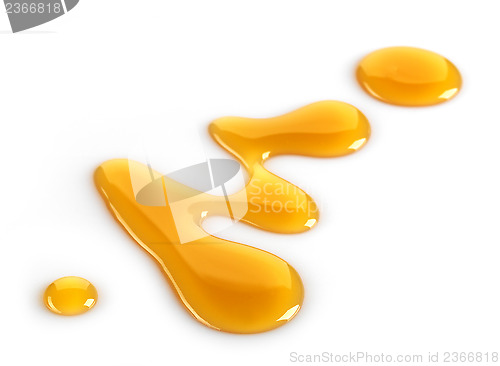 Image of maple syrup on white background