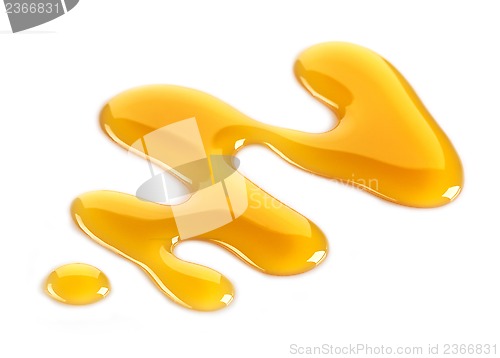 Image of maple syrup on white background