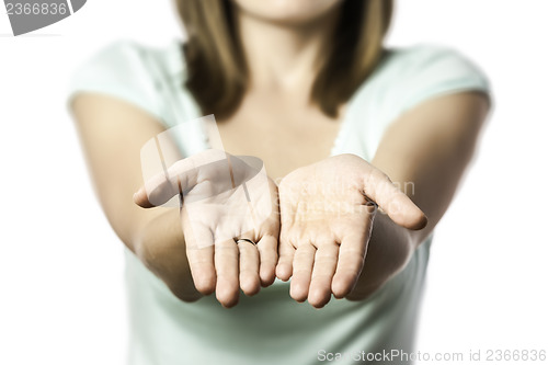 Image of woman stretches out her empty hands