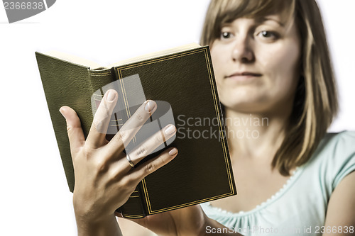 Image of Young girl holding a book