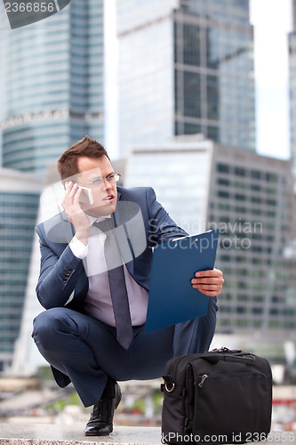 Image of Successful businessman holding a planning