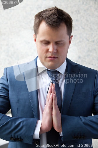 Image of Successful businessman meditation