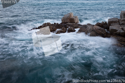 Image of wave and rock
