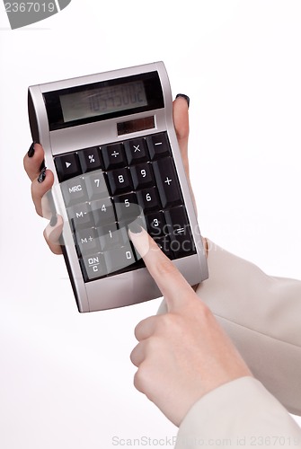 Image of attractive smiling redhead business woman with calculator isolated