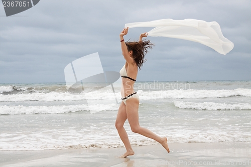 Image of brunette attractive woman carefree on beach summer freedom