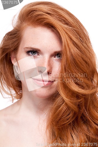 Image of beautiful young smiling woman with red hair and freckles isolated