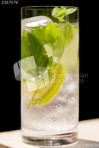 Image of fresh cold refreshment drink mineral water soda with lime and mint