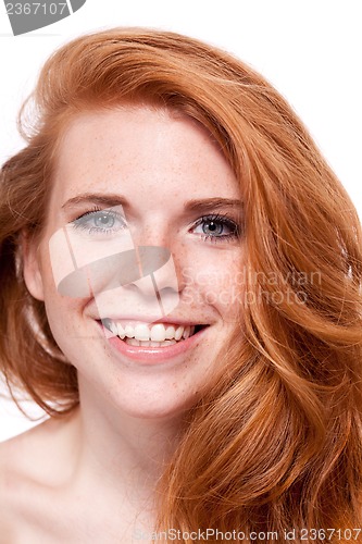 Image of beautiful young smiling woman with red hair and freckles isolated