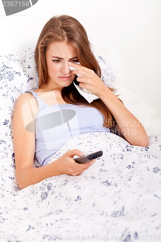 Image of young attractive woman watching movie tv expression 