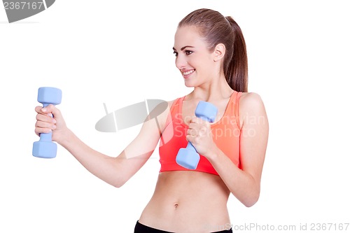 Image of healthy smiling girl workout with dumbbell isolated 