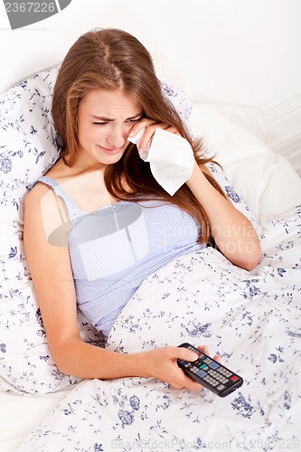Image of young attractive woman watching movie tv expression 