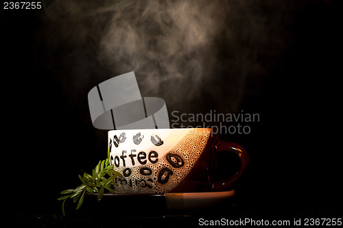 Image of Steaming hot cup of coffee