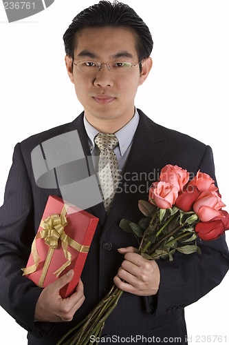 Image of Asian People With Roses And Present