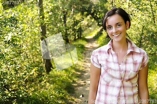 Image of Young Caucasian girl on a hiking path