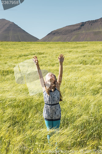 Image of Young girl praying to god