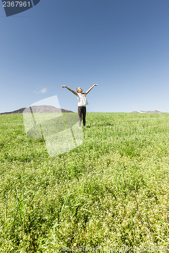 Image of Girl smiling into the sky