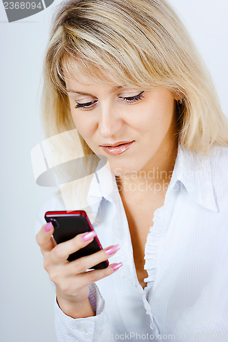 Image of portrait of blonde girl with mobile phone
