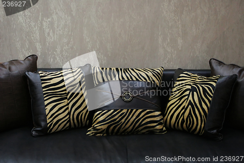 Image of Modern sofa with leopard skin cushions (copy space) - home inter